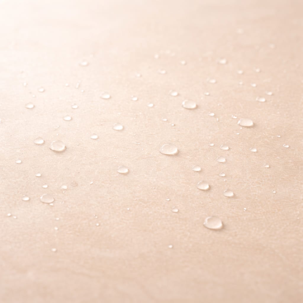 aevora-cleans-hydrated-surface-preparation Ultra-smooth warm ivory surface with fine, evenly dispersed water droplets, representing gentle cleansing and surface preparation.