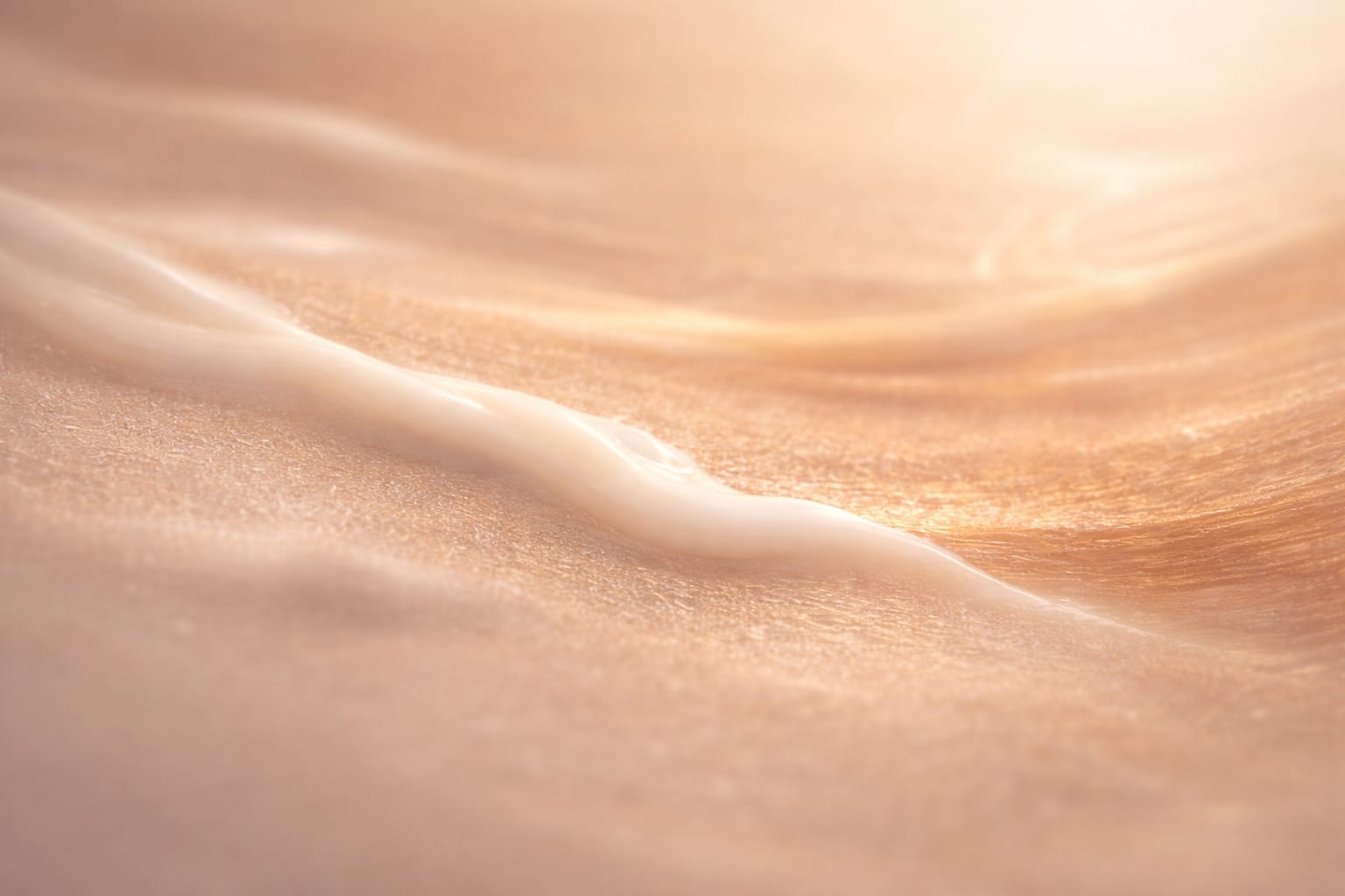 Close-up of a moisturising cream absorbed into skin, representing comfort, hydration, and gentle warmth.